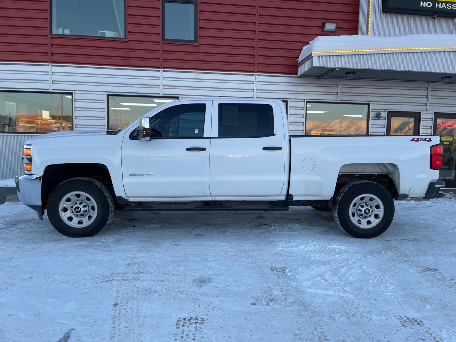 2019 White /Gray Chevrolet Silverado 3500HD Crew Cab 4WD (1GC4KVEY4KF) with an 6.6L V8 OHV 32V TURBO DIESEL engine, 6A transmission, located at 1960 Industrial Drive, Wasilla, 99654, (907) 376-5555, 61.573475, -149.400146 - Photo #1