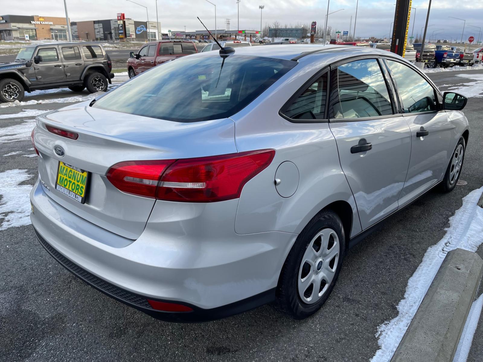 2017 Silver /Black Ford Focus S Sedan (1FADP3E26HL) with an 2.0L L4 DOHC 16V engine, 5-speed Manual transmission, located at 1960 Industrial Drive, Wasilla, 99654, (907) 376-5555, 61.573475, -149.400146 - Photo #5
