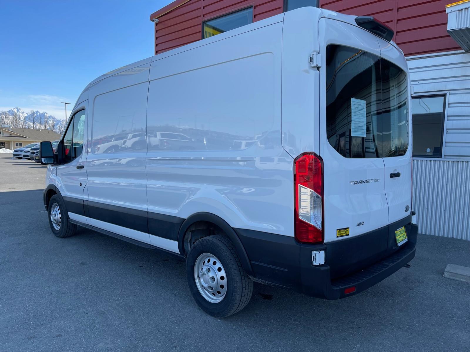 2021 White /Gray Ford Transit 250 Van Med. Roof w/Sliding Pass. 148-in. WB (1FTBR2C87MK) with an 3.5L V6 DOHC 24V engine, 6A transmission, located at 1960 Industrial Drive, Wasilla, 99654, (907) 376-5555, 61.573475, -149.400146 - Photo #2