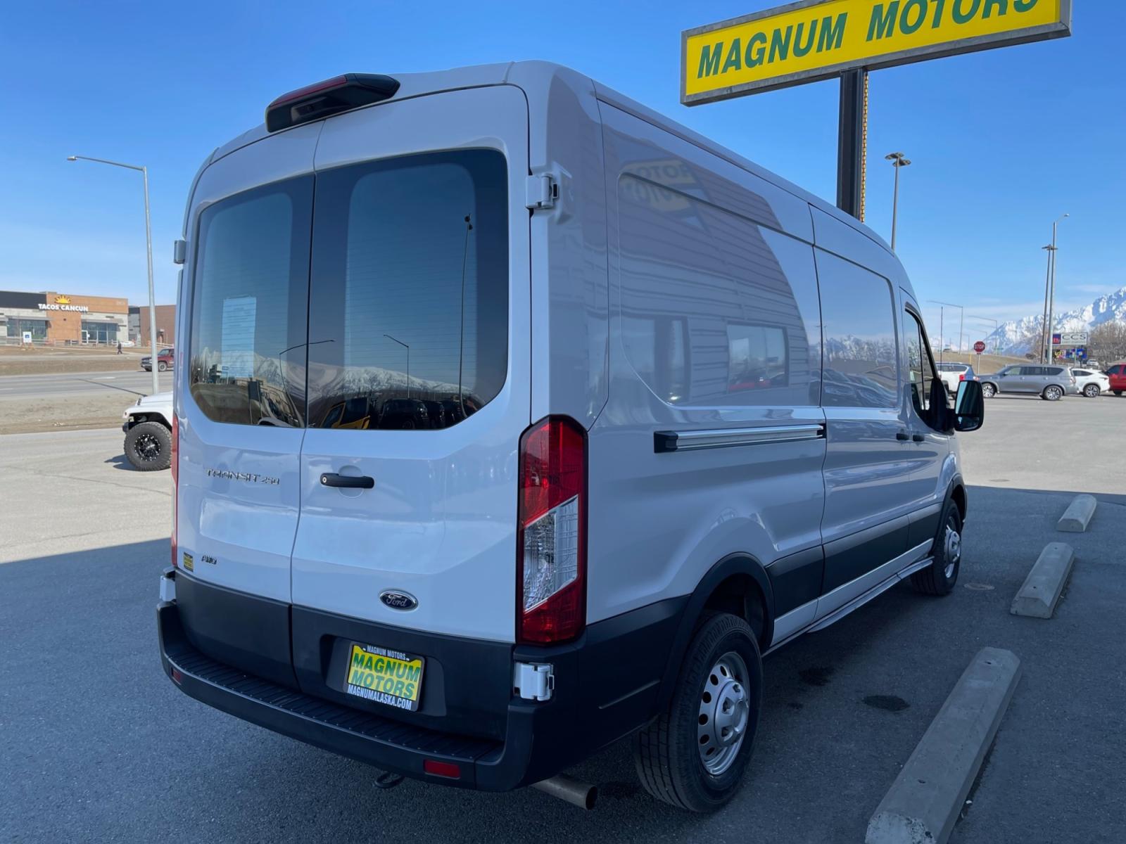 2021 White /Gray Ford Transit 250 Van Med. Roof w/Sliding Pass. 148-in. WB (1FTBR2C87MK) with an 3.5L V6 DOHC 24V engine, 6A transmission, located at 1960 Industrial Drive, Wasilla, 99654, (907) 376-5555, 61.573475, -149.400146 - Photo #4