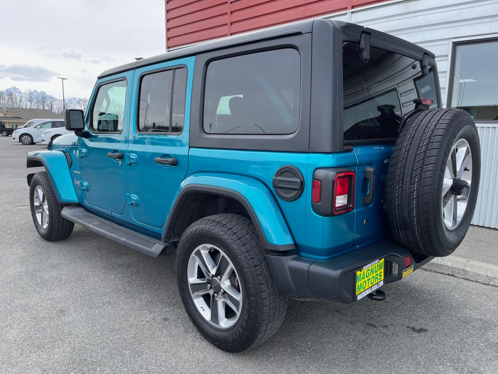 2020 Teal /Black Jeep Wrangler Unlimited Sahara (1C4HJXENXLW) with an 2.0L L4 DOHC 16V TURBO engine, 6A transmission, located at 1960 Industrial Drive, Wasilla, 99654, (907) 376-5555, 61.573475, -149.400146 - Photo #3