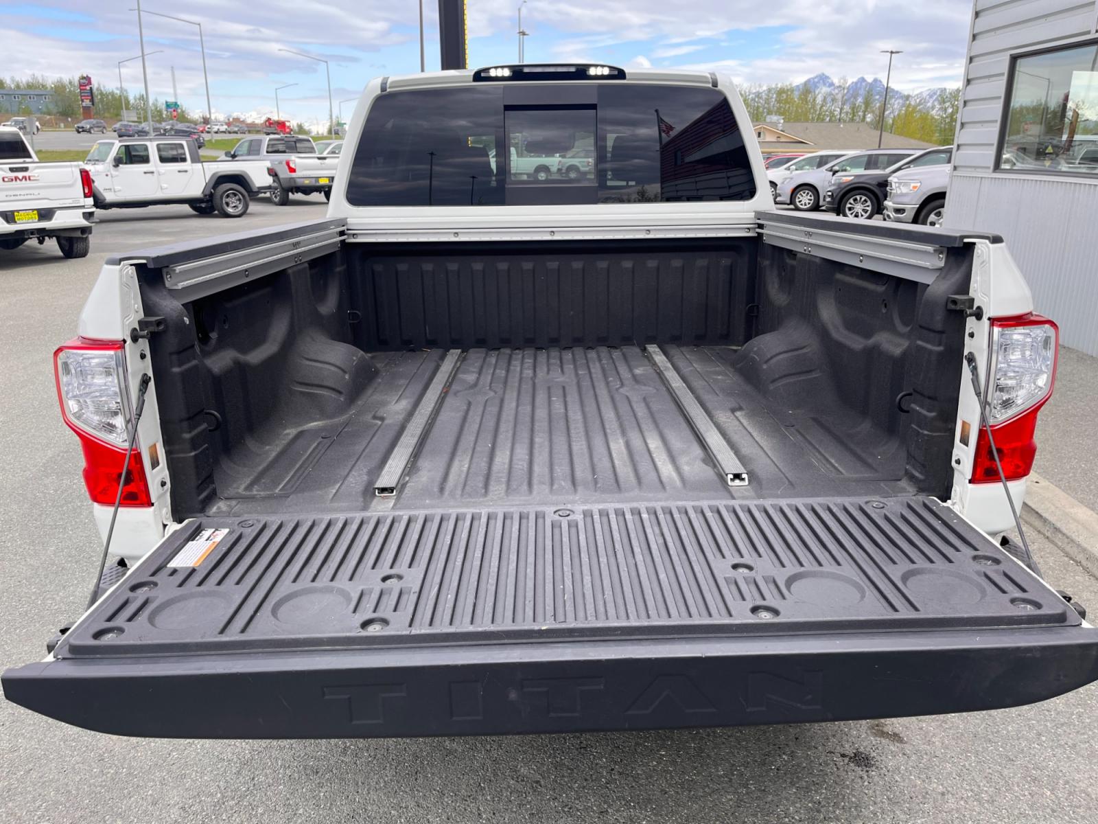 2021 White Nissan Titan SV Crew Cab 4WD (1N6AA1ED9MN) with an 5.6L V8 DOHC 32V engine, 9A transmission, located at 1960 Industrial Drive, Wasilla, 99654, (907) 376-5555, 61.573475, -149.400146 - Photo #18