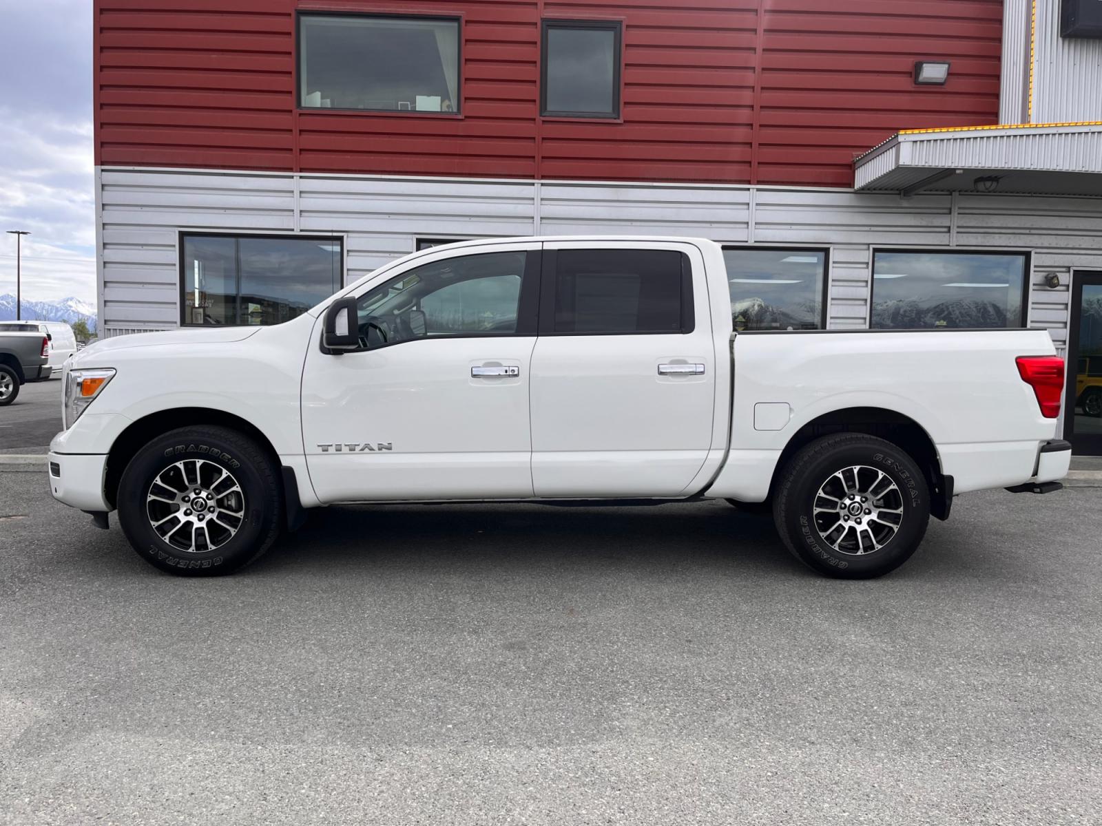 2021 White Nissan Titan SV Crew Cab 4WD (1N6AA1ED9MN) with an 5.6L V8 DOHC 32V engine, 9A transmission, located at 1960 Industrial Drive, Wasilla, 99654, (907) 376-5555, 61.573475, -149.400146 - Photo #2