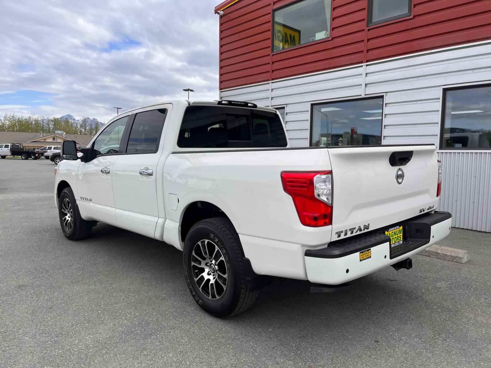 2021 White Nissan Titan SV Crew Cab 4WD (1N6AA1ED9MN) with an 5.6L V8 DOHC 32V engine, 9A transmission, located at 1960 Industrial Drive, Wasilla, 99654, (907) 376-5555, 61.573475, -149.400146 - Photo #3