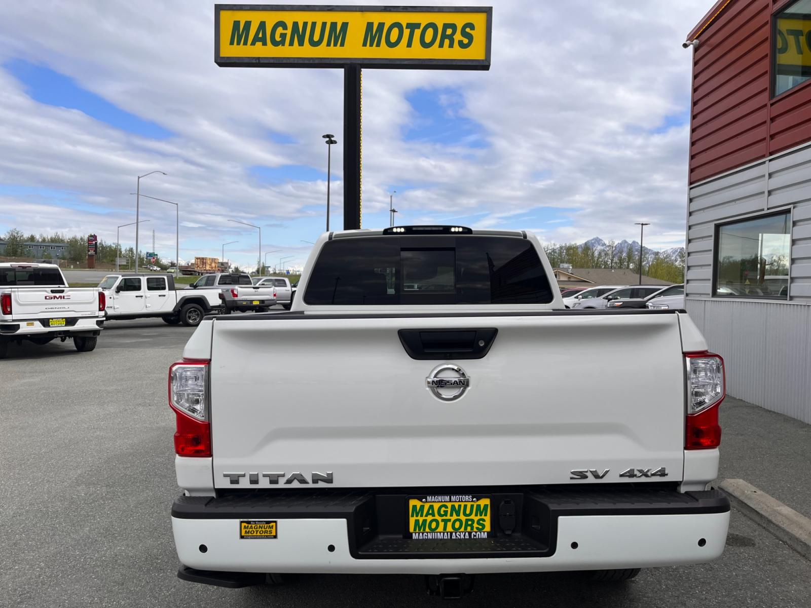 2021 White Nissan Titan SV Crew Cab 4WD (1N6AA1ED9MN) with an 5.6L V8 DOHC 32V engine, 9A transmission, located at 1960 Industrial Drive, Wasilla, 99654, (907) 376-5555, 61.573475, -149.400146 - Photo #4