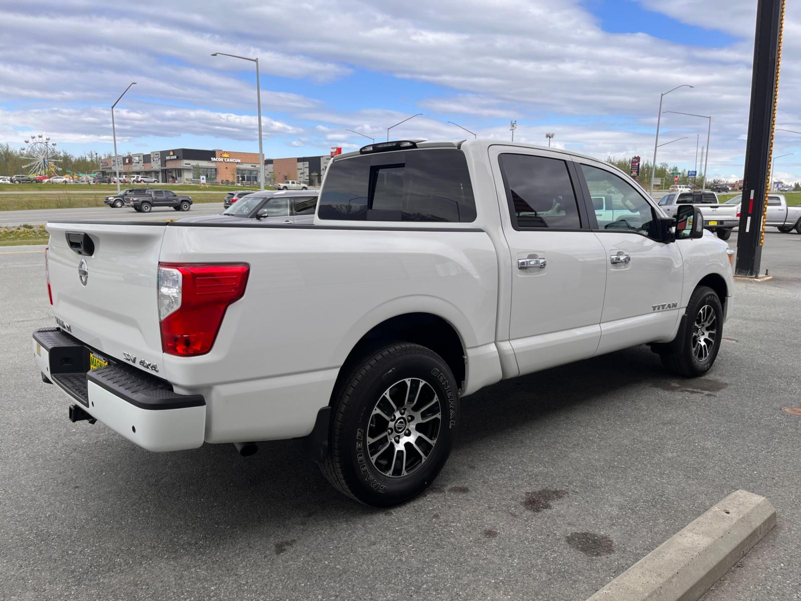 2021 White Nissan Titan SV Crew Cab 4WD (1N6AA1ED9MN) with an 5.6L V8 DOHC 32V engine, 9A transmission, located at 1960 Industrial Drive, Wasilla, 99654, (907) 376-5555, 61.573475, -149.400146 - Photo #5