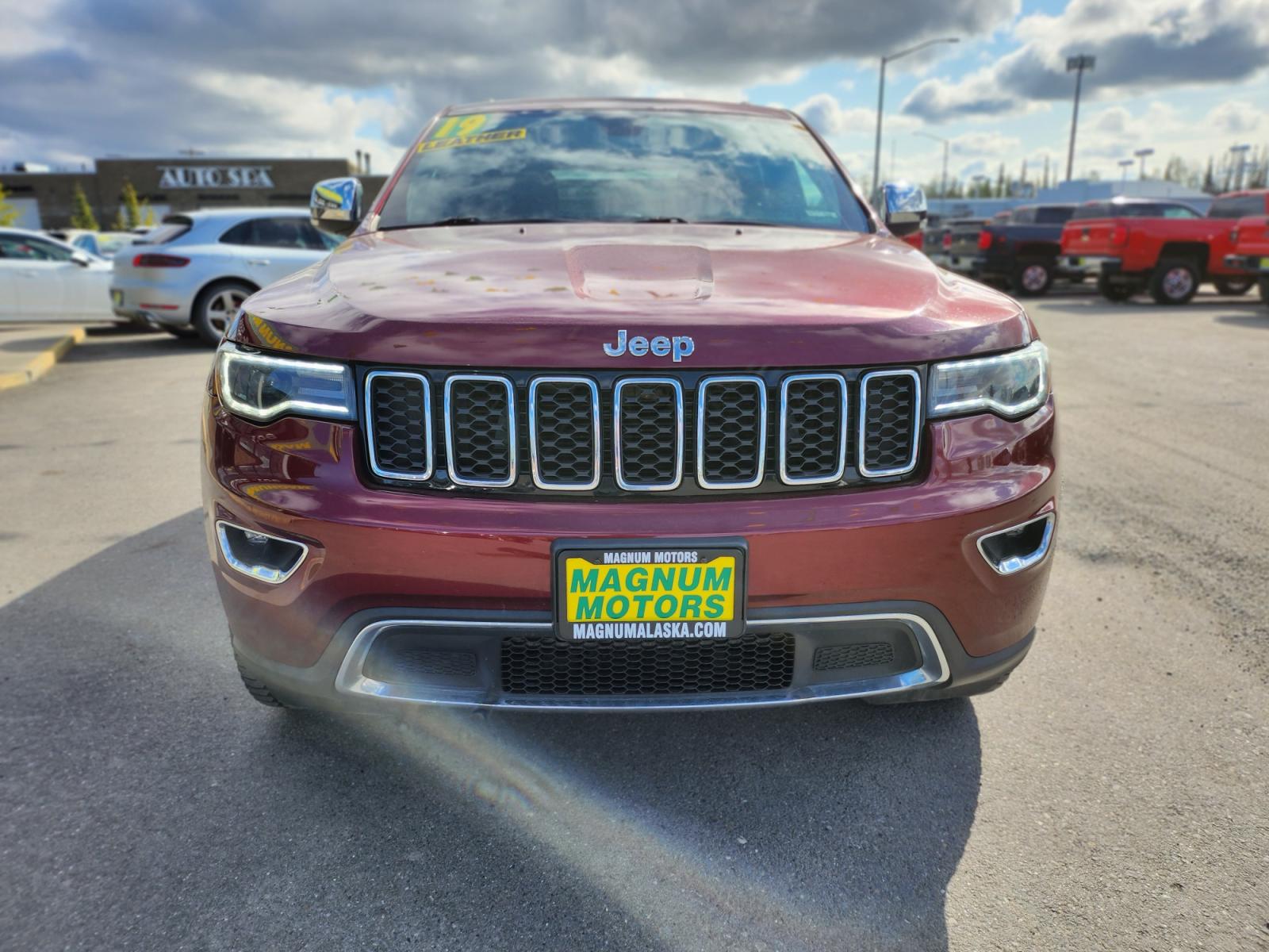 2019 Red /Black Nappa leather Jeep Grand Cherokee Limited 4WD (1C4RJFBG5KC) with an 3.6L V6 DOHC 24V engine, 8A transmission, located at 44152 Sterling Highway, Soldotna, 99669, (907) 262-5555, 60.484917, -151.062408 - JEEP GRAND CHEROKEE LIMITED 4X4 Exterior Color: Velvet Red Pearl–Coat Exterior Paint Interior Color: Black Interior Color Interior: Leather Trim Seats with Perforated Inserts Engine: 3.6–Liter V6 24–Valve VVT Engine Transmission: 8–Speed Automatic Transmission Advanced Multistage F - Photo #0