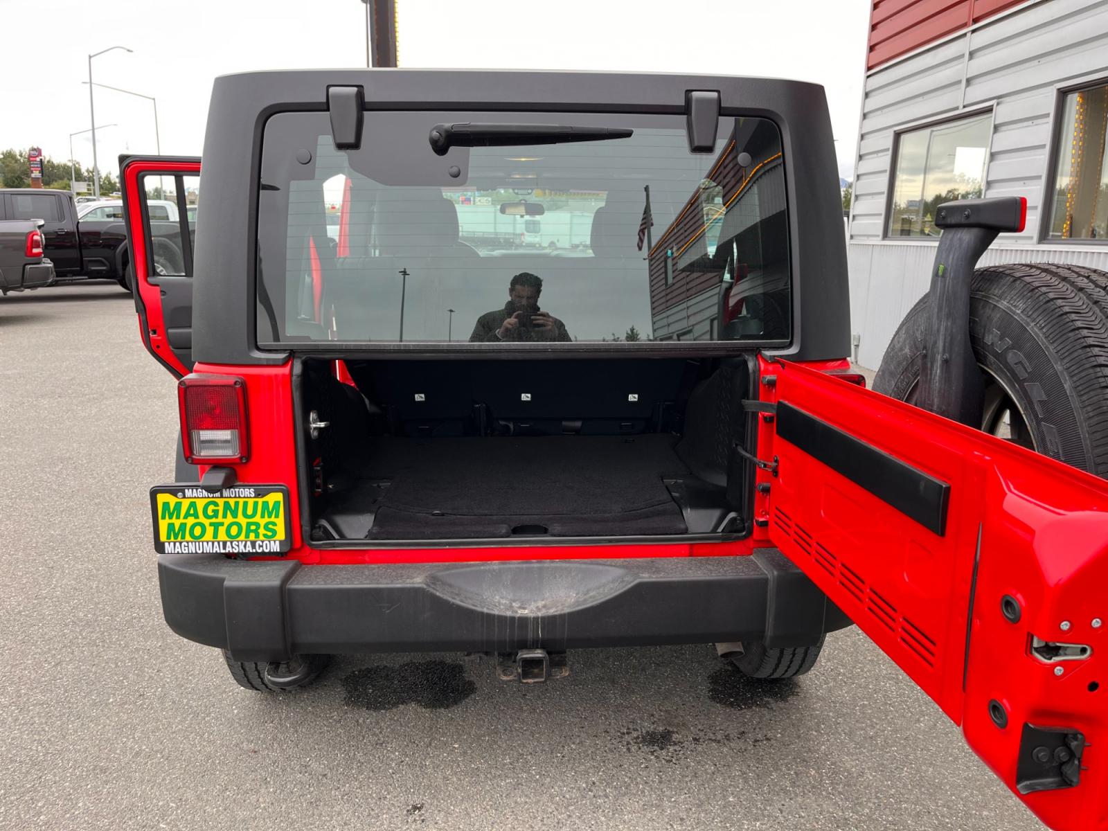 2018 Red Jeep Wrangler Unlimited Sport 4WD (1C4BJWDG2JL) with an 3.6L V6 DOHC 24V FFV engine, located at 44152 Sterling Highway, Soldotna, 99669, (907) 262-5555, 60.484917, -151.062408 - Photo #11