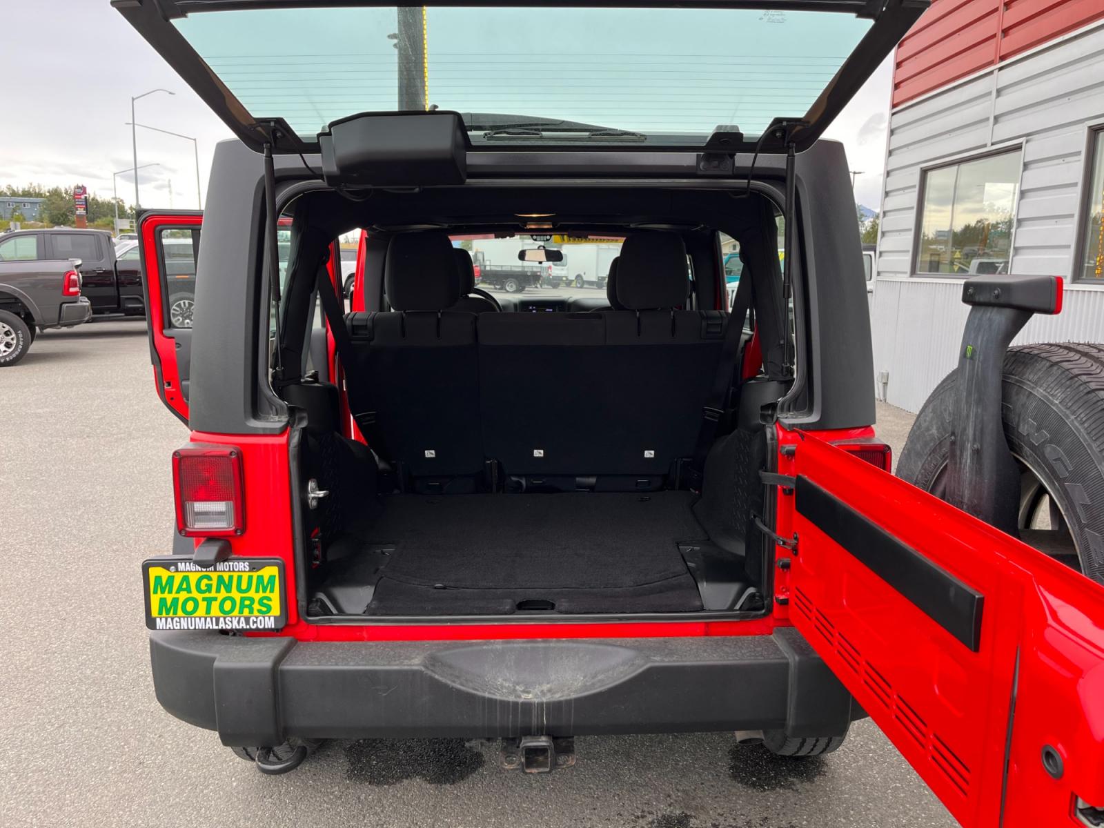 2018 Red Jeep Wrangler Unlimited Sport 4WD (1C4BJWDG2JL) with an 3.6L V6 DOHC 24V FFV engine, located at 44152 Sterling Highway, Soldotna, 99669, (907) 262-5555, 60.484917, -151.062408 - Photo #12
