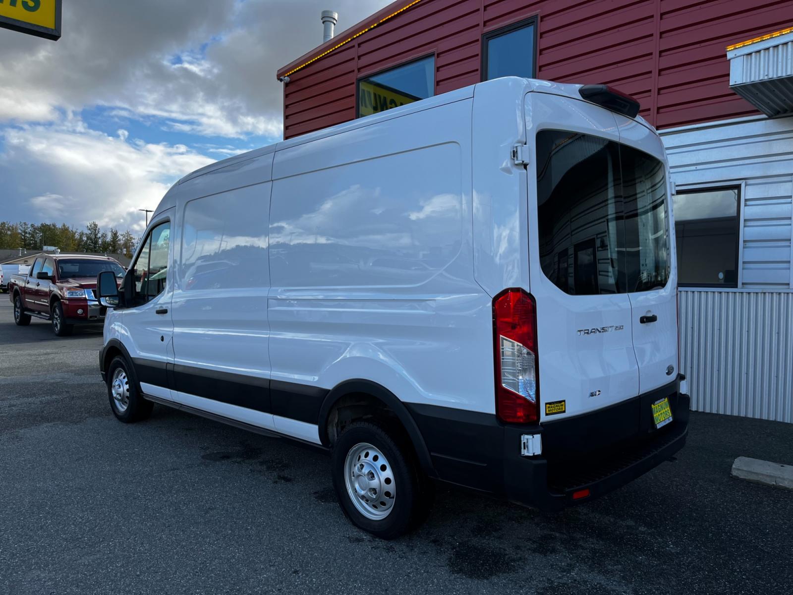 2021 White /Black Ford Transit 250 Van Med. Roof w/Sliding Pass. 148-in. WB (1FTBR2C84MK) with an 3.5L V6 DOHC 24V engine, 6A transmission, located at 1960 Industrial Drive, Wasilla, 99654, (907) 376-5555, 61.573475, -149.400146 - Photo #2