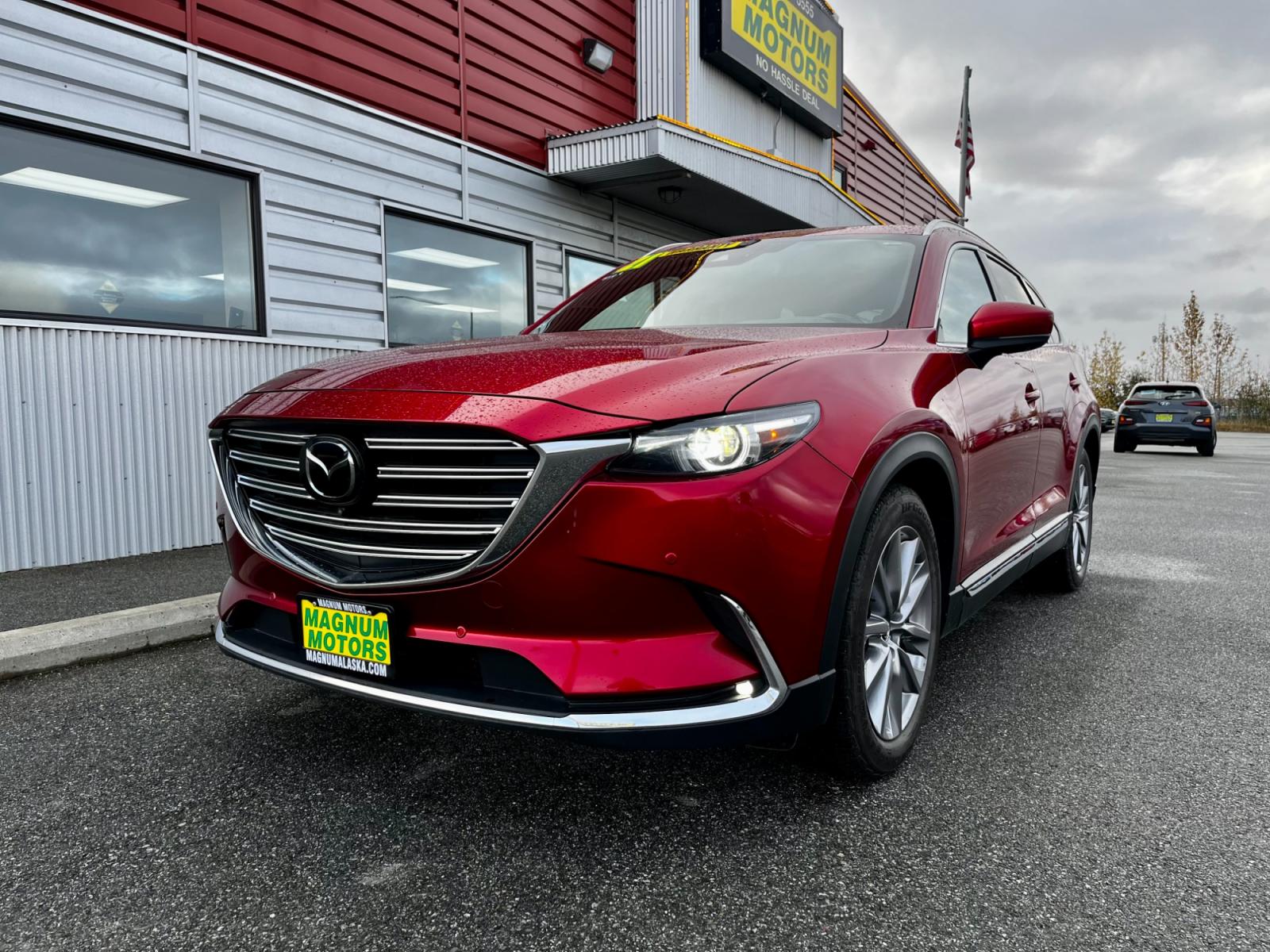 2021 Red /Black Mazda CX-9 Grand Touring AWD (JM3TCBDY7M0) with an 2.5L L4 DOHC 16V engine, 6A transmission, located at 1960 Industrial Drive, Wasilla, 99654, (907) 376-5555, 61.573475, -149.400146 - Photo #0