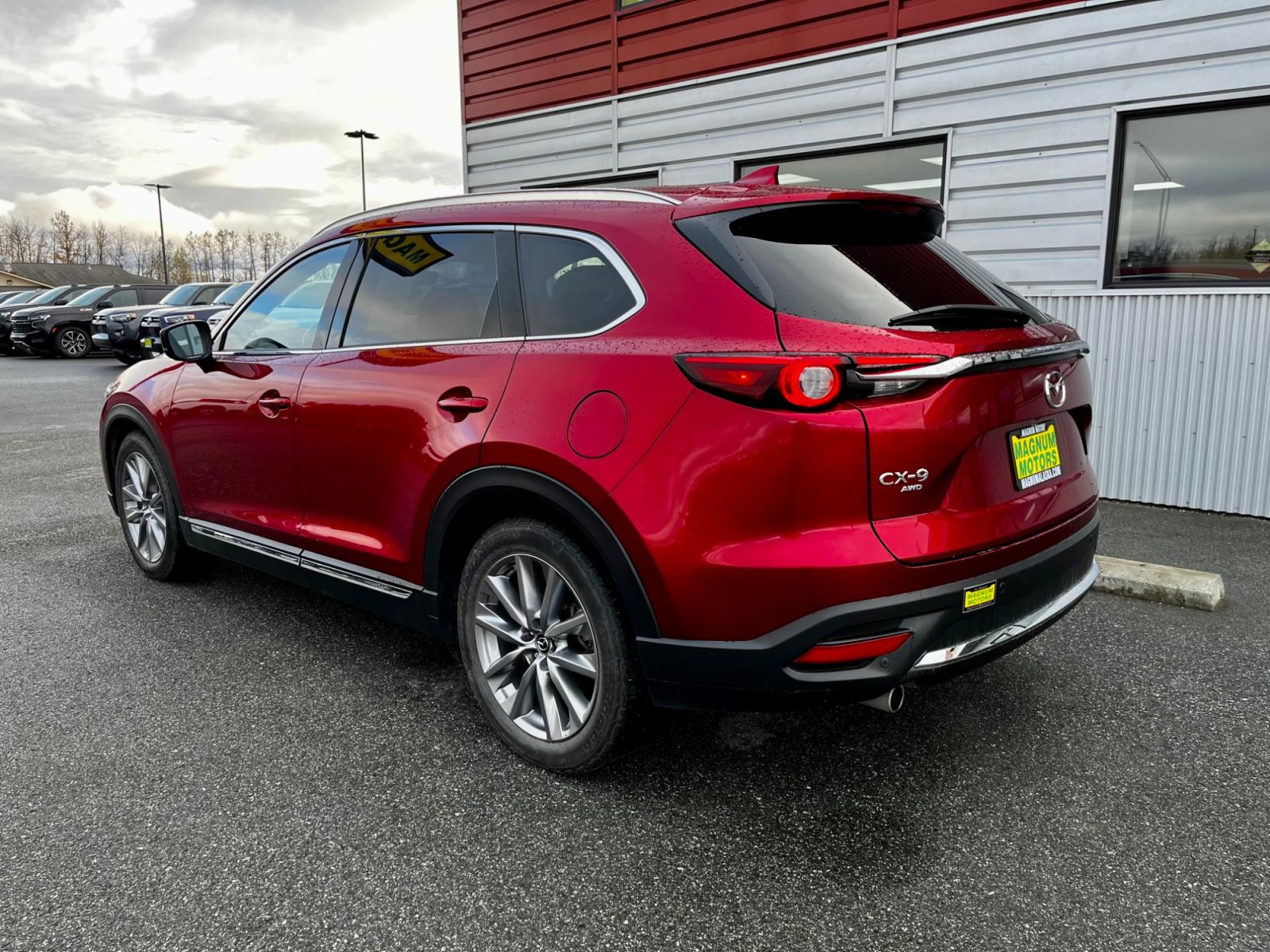 2021 Red /Black Mazda CX-9 Grand Touring AWD (JM3TCBDY7M0) with an 2.5L L4 DOHC 16V engine, 6A transmission, located at 1960 Industrial Drive, Wasilla, 99654, (907) 376-5555, 61.573475, -149.400146 - Photo #3